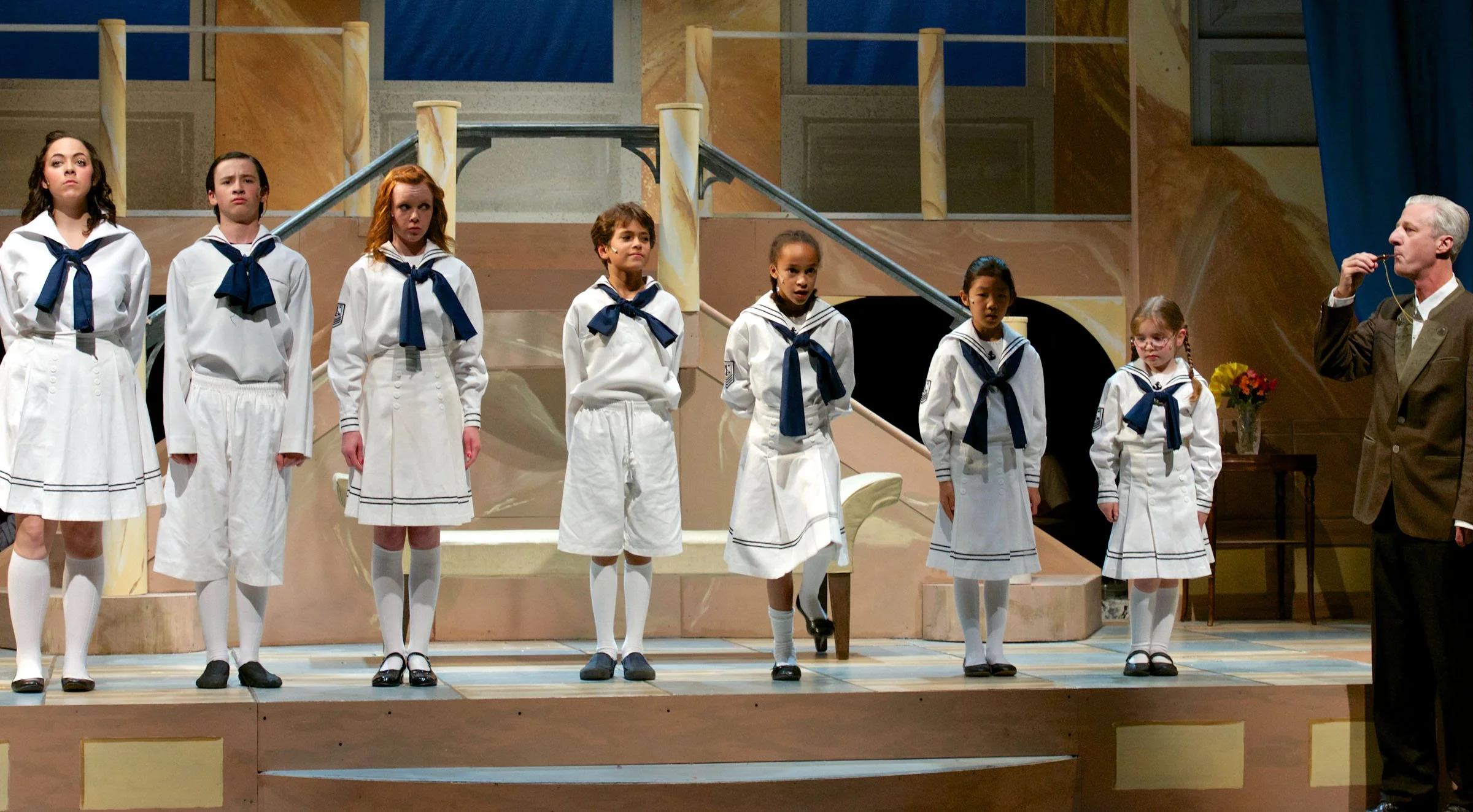 The children of The Sound of Music in sailor uniforms.